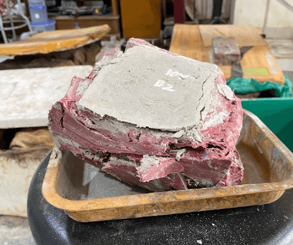 A freshly molded brick block, cross-section view